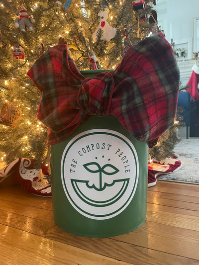 Green The Compost People 5 gallon with a bow to represent a gift card